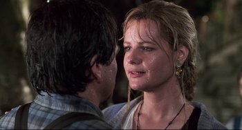 Movie still from “Jumanji” (1995), directed by Joe Johnston – A young woman standing next to a young man; Close Up shot, Over the shoulder angle