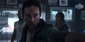 Movie still from “Black Summer” (2019), created by John Hyams – A person with blood on his face; Close Up shot, Low angle