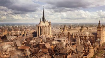 Movie still from “Knightfall” (2017), created by Richard Rayner – An aerial view of an old european city; Extreme Wide shot, High angle