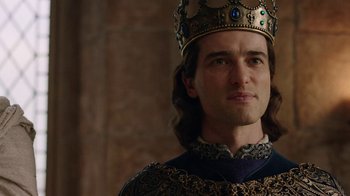 Movie still from “Knightfall” (2017), created by Richard Rayner – A person wearing a crown; Close Up shot, Over the shoulder angle