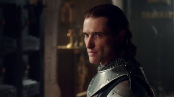 Movie still from “Knightfall” (2017), created by Richard Rayner – A person wearing a suit of armor; Close Up shot, Over the shoulder angle