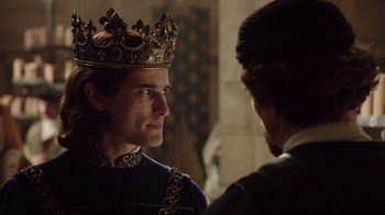 Movie still from “Knightfall” (2017), created by Richard Rayner – A man wearing a crown talking to another man; Close Up shot, Over the shoulder angle