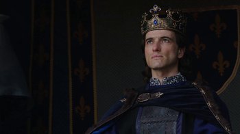 Movie still from “Knightfall” (2017), created by Richard Rayner – A person wearing a crown; Close Up shot, Low angle