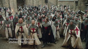Movie still from “Knightfall” (2017), created by Richard Rayner – A large group of people dressed as knights; Wide shot, High angle