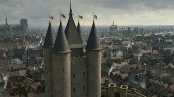 Movie still from “Knightfall” (2017), created by Richard Rayner – A view of a city from above with three towers; Extreme Wide shot, High angle