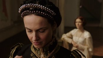 Movie still from “Knightfall” (2017), created by Richard Rayner – A person wearing a dress; Close Up shot, Over the shoulder angle