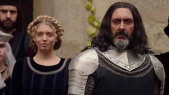 Movie still from “Knightfall” (2017), created by Richard Rayner – A man and a woman dressed in medieval garb; Medium shot, Over the shoulder angle