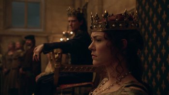 Movie still from “Knightfall” (2017), created by Richard Rayner – Two people sitting on a chair wearing crowns; Medium shot, Over the shoulder angle
