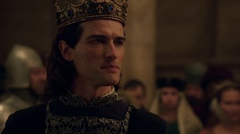 Movie still from “Knightfall” (2017), created by Richard Rayner – A person wearing a crown; Close Up shot, Over the shoulder angle
