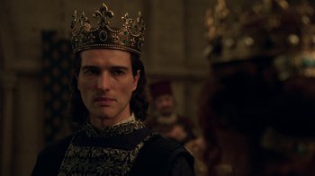 Movie still from “Knightfall” (2017), created by Richard Rayner – A person wearing a crown; Close Up shot, Over the shoulder angle