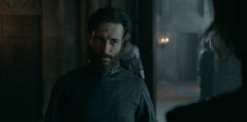 Movie still from “Knightfall” (2017), created by Richard Rayner – A man with a long beard standing next to another man; Close Up shot, Over the shoulder angle