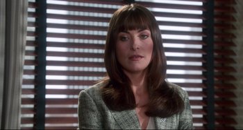 Movie still from “Liar Liar” (1997), directed by Tom Shadyac – A person wearing a suit and tie; Close Up shot, Over the shoulder angle