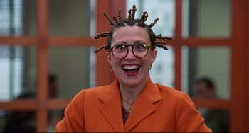 Movie still from “Liar Liar” (1997), directed by Tom Shadyac – A person with a weird hair style and glasses; Close Up shot, High angle