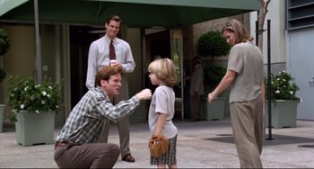 Movie still from “Liar Liar” (1997), directed by Tom Shadyac – A young boy holding a catchers mitt in front of two men; Medium shot, Over the shoulder angle