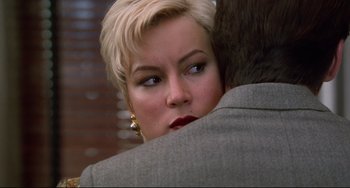 Movie still from “Liar Liar” (1997), directed by Tom Shadyac – A person with short blonde hair; Close Up shot, Over the shoulder angle