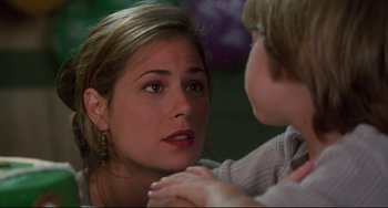 Movie still from “Liar Liar” (1997), directed by Tom Shadyac – A woman and a child looking at one another; Close Up shot, Over the shoulder angle