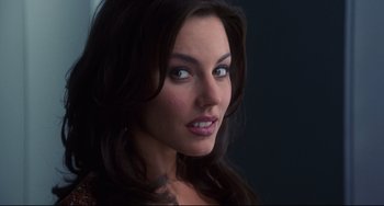 Movie still from “Liar Liar” (1997), directed by Tom Shadyac – A woman's face in a dark room; Close Up shot, Over the shoulder angle