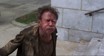 Movie still from “Liar Liar” (1997), directed by Tom Shadyac – An old man with a sad look on his face; Medium shot, High angle