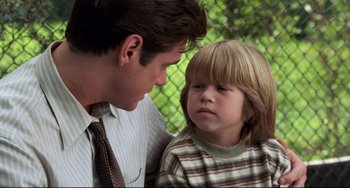 Movie still from “Liar Liar” (1997), directed by Tom Shadyac – A man and a child looking at each other; Close Up shot, Over the shoulder angle