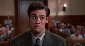 Movie still from “Liar Liar” (1997), directed by Tom Shadyac – A man in a suit and a tie; Close Up shot, Low angle