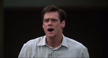 Movie still from “Liar Liar” (1997), directed by Tom Shadyac – A person wearing a white shirt; Close Up shot, Low angle
