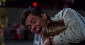 Movie still from “Liar Liar” (1997), directed by Tom Shadyac – A man is holding a woman's hair and laughing; Close Up shot, Low angle