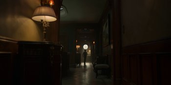 Movie still from “Locke & Key” (2020), created by Carlton Cuse – A person is walking in a dark hallway; Extreme Wide shot, Low angle