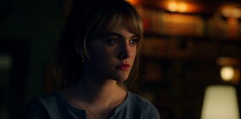Movie still from “Locke & Key” (2020), created by Carlton Cuse – A beautiful young lady looking at the camera; Close Up shot, Over the shoulder angle