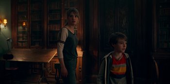 Movie still from “Locke & Key” (2020), created by Carlton Cuse – A girl and a boy are standing in a room; Medium shot, Over the shoulder angle