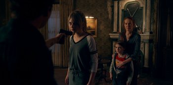 Movie still from “Locke & Key” (2020), created by Carlton Cuse – A group of people in a room with a camera; Medium shot, Over the shoulder angle