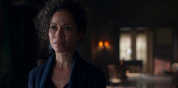 Movie still from “Locke & Key” (2020), created by Carlton Cuse – A person with curly hair looking at the camera; Close Up shot, Over the shoulder angle