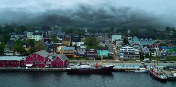 Movie still from “Locke & Key” (2020), created by Carlton Cuse – A large boat in the middle of a harbor; Extreme Wide shot, High angle