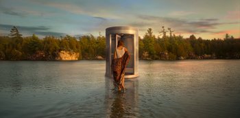 Movie still from “Locke & Key” (2020), created by Carlton Cuse – A woman standing in the middle of a body of water; Extreme Wide shot, Low angle