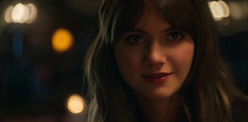 Movie still from “Locke & Key” (2020), created by Carlton Cuse – A woman's face with lights in the background; Close Up shot, Over the shoulder angle