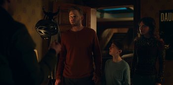 Movie still from “Locke & Key” (2020), created by Carlton Cuse – A man standing next to a young boy in a room; Medium shot, Over the shoulder angle