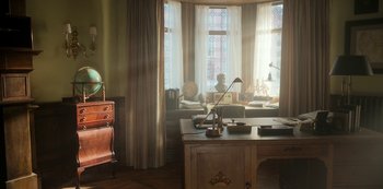 Movie still from “Locke & Key” (2020), created by Carlton Cuse – A room with a desk and a large window; Wide shot, High angle