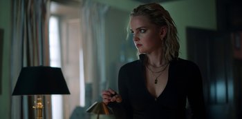 Movie still from “Locke & Key” (2020), created by Carlton Cuse – A beautiful blonde woman holding a cigarette in her hand; Close Up shot, Low angle