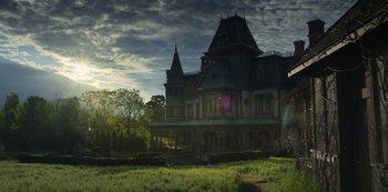 Movie still from “Locke & Key” (2020), created by Carlton Cuse – An old house with a very tall tower on top of it; Extreme Wide shot, Low angle