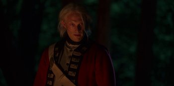 Movie still from “Locke & Key” (2020), created by Carlton Cuse – A man with long white hair wearing a red jacket; Close Up shot, Over the shoulder angle