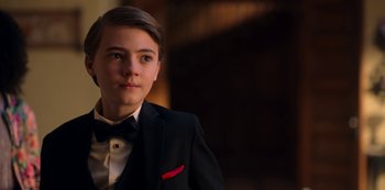 Movie still from “Locke & Key” (2020), created by Carlton Cuse – A young man in a suit and bow tie; Close Up shot, Over the shoulder angle