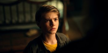 Movie still from “Locke & Key” (2020), created by Carlton Cuse – A young boy is looking into the distance; Close Up shot, High angle