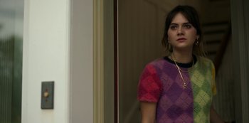 Movie still from “Locke & Key” (2020), created by Carlton Cuse – A woman standing in front of a mirror wearing a necklace; Close Up shot, Over the shoulder angle