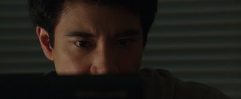 Movie still from “Blackhat” (2015), directed by Michael Mann – A man's face with his eyes wide open; Extreme Close Up shot, High angle