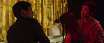 Movie still from “Blackhat” (2015), directed by Michael Mann – A man and a woman looking in a mirror; Medium shot, Over the shoulder angle