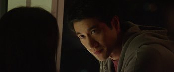 Movie still from “Blackhat” (2015), directed by Michael Mann – A person looking at the camera; Close Up shot, Over the shoulder angle