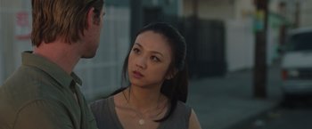 Movie still from “Blackhat” (2015), directed by Michael Mann – A young woman is talking to a young man outside; Close Up shot, Over the shoulder angle