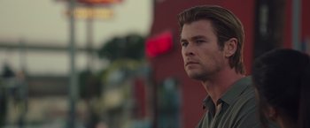 Movie still from “Blackhat” (2015), directed by Michael Mann – A person wearing a green shirt; Close Up shot, Low angle