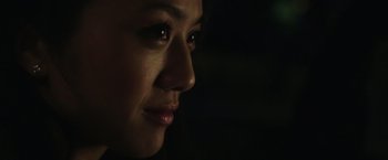 Movie still from “Blackhat” (2015), directed by Michael Mann – A person's face in the dark; Close Up shot, Low angle