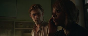 Movie still from “Blackhat” (2015), directed by Michael Mann – A man and a woman standing next to each other; Close Up shot, Over the shoulder angle