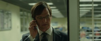 Movie still from “Blackhat” (2015), directed by Michael Mann – A person talking on a cell phone; Close Up shot, Low angle